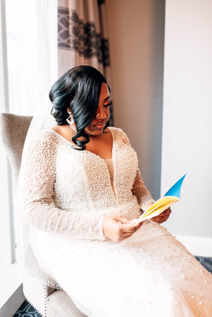 Bride reading her vows in hotel room at Kimpton Tryon Park hotel