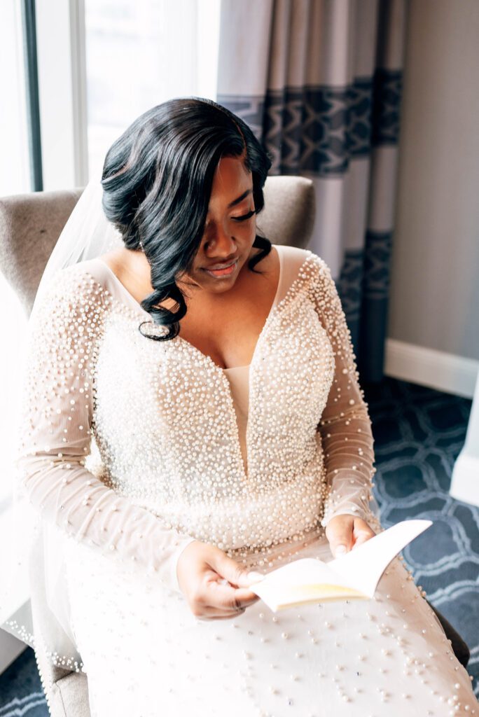 Bride reading her vows in hotel room at Kimpton Tryon Park hotel